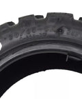 Close-up of the rugged tread on Heavy Duty Off Road Vacuum Tubeless Tire 90 65 6.5 Replacement For Motorcycles And Electric Skateboards