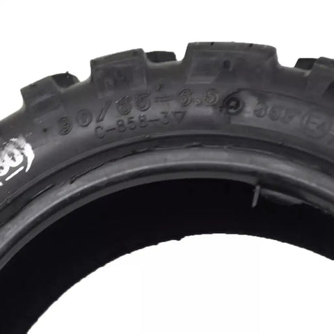 Close-up of the rugged tread on Heavy Duty Off Road Vacuum Tubeless Tire 90 65 6.5 Replacement For Motorcycles And Electric Skateboards