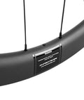 Close-up of Aero Carbon Wheel Set With Center Lock Disc Hubs, 45mm Deep Clincher, 25mm Width, UD Matte Carbon Weave UV Protection
