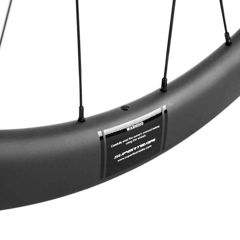 Close-up of Aero Carbon Wheel Set With Center Lock Disc Hubs, 45mm Deep Clincher, 25mm Width, UD Matte Carbon Weave UV Protection
