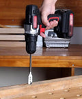 Straight Up No Sweat Cordless Drill With Variable Speed Lithium Ion Battery And Charger Set For Quick Home Repair Jobs Featuring Keyless Chuck And Bright Led Light in use, drilling into wood.
