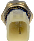 Close-up of Dorman 926-711 cylinder head temperature sensor with beige plastic connector