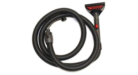 Front view of Bissell commercial hose and upholstery tool with black ribbed hose and wide upholstery nozzle.