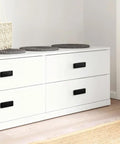 Five Pack Invisible Flush Drawer Pull Handles Matte Black Zinc Alloy Hidden Cabinet Pulls installed on white cabinet drawers.