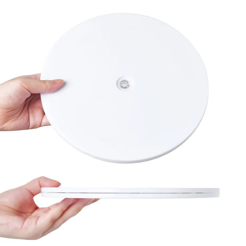 Hands holding a 6 Inch White Acrylic Lazy Susan Turntable With Ball Bearing Swivel For Smooth 360 Degree Rotation, Great For Spice Racks