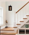 Set Of Two Farmhouse Wall Sconces With Modern Industrial Vibe, Matte Black Finish And Faux Wood Backing in a stairway
