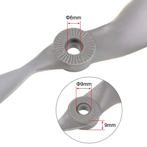 Close-up of RC Propellers 10x7 Inch Two Vane Nylon Gray for Airplane Pack of 3 With Adapter Rings showing 6mm and 9mm adapter sizes