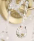 Close-up of a clear crystal drop from a Modern Crystal Wall Sconce With E27 Socket For Bedroom And Living Room.