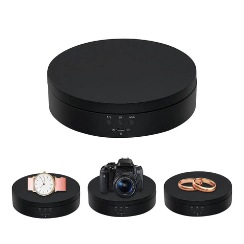360 Degree Rotating Display Stand With Motorized Spinning Platform For Photography, black turntable showing watch, camera, rings.