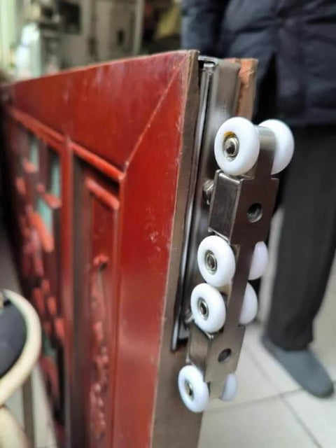Side view of heavy duty sliding barn door hardware track kit with 8 wheel hanger system for exterior use with quiet glide.