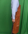 Side view of Leather Welding Apron With Flame Resistant Shield And Six Tool Pockets, Protects Clothes From Spatter And Heat, in brown color