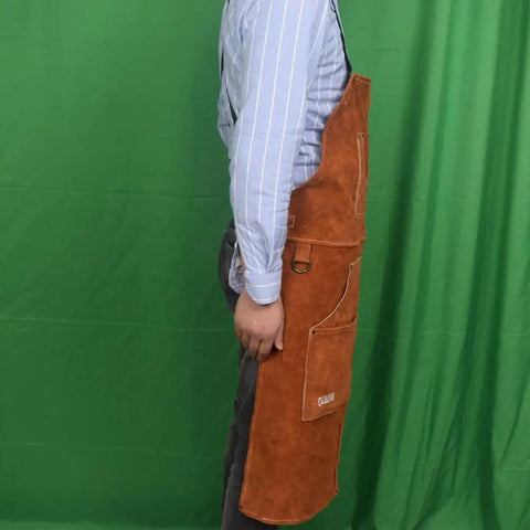 Side view of person wearing Rugged Heat Resistant Welding Apron With Six Tool Pockets, Heavy Duty Leather Forge Apron for Metalworking.