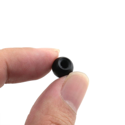 Close-up of Heavy Duty M4 Threaded Cap Nut Knob For Ball Lamp Decor And Tough As Nails Furniture Lighting Fixtures Built To Last Carbon Steel Rust Resistant Hardware For DIY Projects Ceiling Mounts And Decorative Hardware 9mm Cap Diameter With 2.5mm Hole held between fingers
