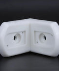 White nylon Beefy Heavy Duty L Shaped Corner Bracket For Furniture Repair And Shelf Support 90 Degree Right Angle Reinforcement Bracket Made From Durable Nylon For Strong Joints And Easy Install with mounting holes on a black background