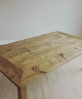 Premium Oil Based Penetrating Interior Wood Stain With Low Voc Levels For A Dang Good Natural Wood Look That Glides On Easy And Enhances Real Grain Texture In A Handy Half Pint Can on a rustic wooden dining table.