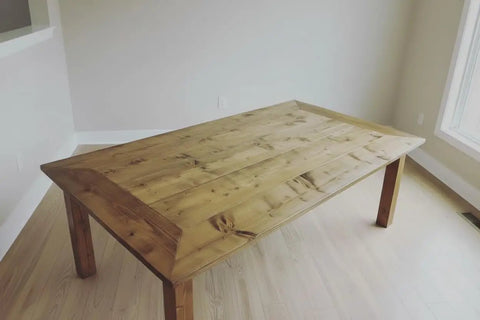 Premium Oil Based Penetrating Interior Wood Stain With Low Voc Levels For A Dang Good Natural Wood Look That Glides On Easy And Enhances Real Grain Texture In A Handy Half Pint Can on a rustic wooden dining table.