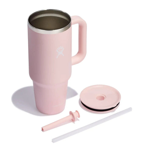 On The Fly 40 Oz Stainless Steel Travel Tumbler With Comfort Grip Handle And Leak Proof Straw Lid in pink with accessories.