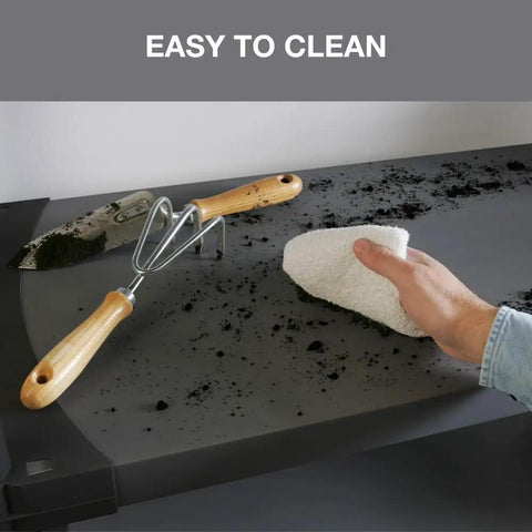 Cleaning the Built Tough 42 Inch Plastic Resin Four Tier Shelving Rack surface with a cloth to showcase easy clean solid panels.