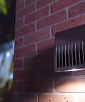 120 Volt Stem and Swivel Mount Thermal Photocontrol with Auto Light Sensor on brick wall