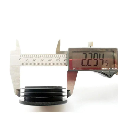 Two And Three Eighths Inch Round Plastic Tubing End Caps with caliper measuring 2.294 inches diameter, eight pack