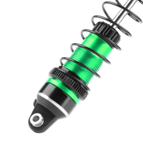 Close-up of green Beefed Up Aluminum 87mm front shock absorber for Mini Maxx & Mini XRT trucks with adjustable spring and tunable damping