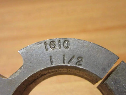 Close-up of Dodge Taper-Lock Bushing 1610 X 1-1/2 KW, PN 117163 with engraved size and part number on metal surface.