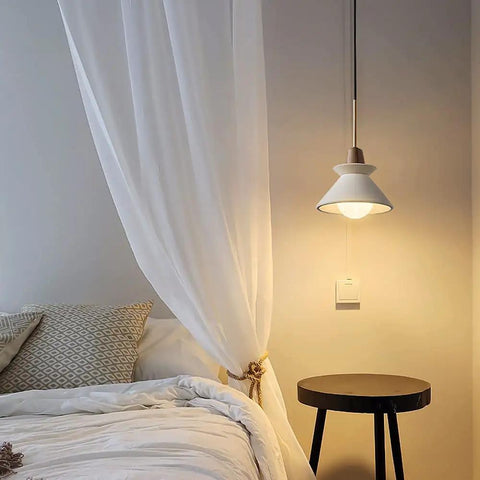 Modern E26 Concrete Pendant Lights Set With Industrial Cement Vibe illuminating a Nordic-style bedroom with minimalist decor.