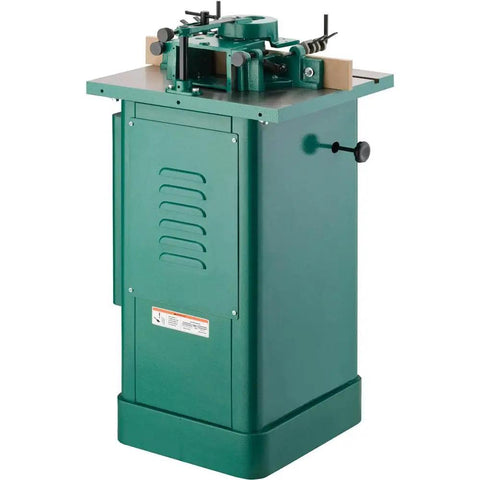 Built Like A Tank One Point Five Horsepower Woodworking Shaper Featuring Massive Twenty By Eighteen Inch Cast Iron Table And Dual Voltage Motor.