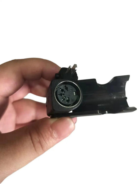 Close-up of Power Recliner Lift Chair Motor Replacement KDPT007-115 Linear Actuator connector, hand-held view.