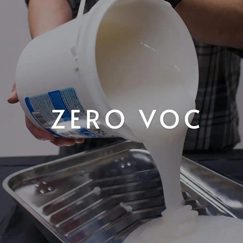 Ultra Clear Strippable Wallpaper Adhesive being poured into a tray, zero VOC, Pro 880 Formula, 32 ounce for 80 sq ft coverage