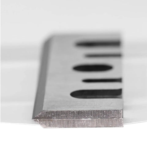 Heavy Duty 3 1/4 Inch Carbide Tipped Planer Blades Set Of Two close-up view of sharp cutting edge for smooth woodworking.
