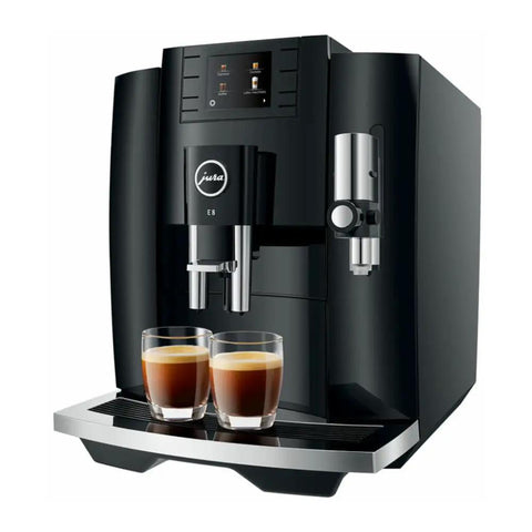 Next Level 5th Gen Automatic Smart Coffee Machine Bundle Featuring Piano Black Finish Plus Matching Glass Milk Frothing Container For Hella Smooth Lattes Bold Espresso And Quick Cappuccino Prep showcasing JURA E8 with double espresso cups.