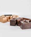 Slick Walnut Wood Espresso Tamping Station With Quick Release Knock Box And Eight Versatile Tool Slots For 58mm Portafilters Distributors And Tampers featuring wooden organizer with tool slots.