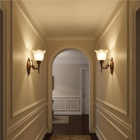 Antique Copper Wall Sconce Light European Vintage Design with Flower Glass Shade Carved Base Indoor Wall Lamp for Bedroom Living Room Hallway Bedside Decor E26/27 in a stylish hallway setting.