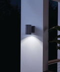 Textured Black LED Outdoor Wall Light With Integrated 3000K LED, Aluminum Wet Location Downlight illuminating a patio pillar