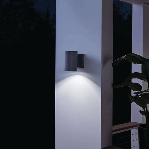 Textured Black LED Outdoor Wall Light With Integrated 3000K LED, Aluminum Wet Location Downlight illuminating a patio pillar
