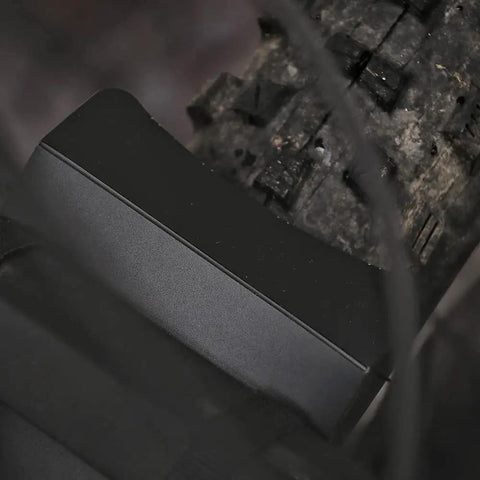 Close-up of Front Mountain Bike Mud Guard Face Fender Shield, black, easy Velcro install on tire, protects from spray and mud.