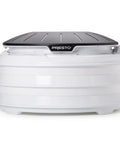 Electric Food Dehydrator With Four Stackable Trays And Top Mounted Fan, compact design with a black lid and white base.