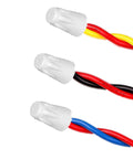Ceramic wire connector caps on three twisted wire pairs: red–yellow, red–black, red–blue.