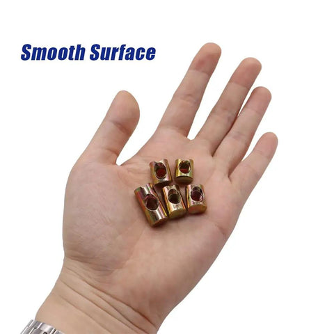 Beast Mode 72 Piece M6 Metric Barrel Nuts And Cross Dowel Slotted Nut Kit in hand, showcasing zinc-coated nuts for furniture.