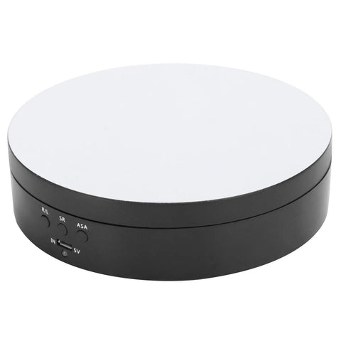 Upgrade Your Game With This Sick Electric Rotating Display Stand Boasting 3 Speeds And 4 Adjustable Angles For Showcasing Jewelry Watches And Cosmetics Like A Boss On A Sleek Black Mirror Surface Turntable Base featuring a round black base with a mirror top.
