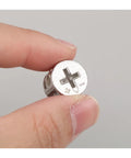 Close-up of a hand holding a zinc alloy piece from 10 Piece Thickened Three In One Connector Eccentric Wheel Set For Furniture Hardware
