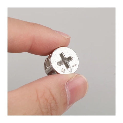 Close-up of a hand holding a zinc alloy piece from 10 Piece Thickened Three In One Connector Eccentric Wheel Set For Furniture Hardware
