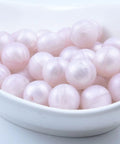 Premium Silicone Beads For Keychain Making And Jewelry Crafting Assorted Sizes with a mint green hue in a white bowl.