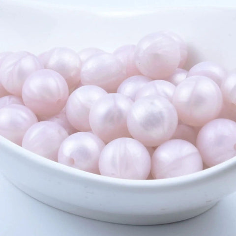 Premium Silicone Beads For Keychain Making And Jewelry Crafting Assorted Sizes with a mint green hue in a white bowl.