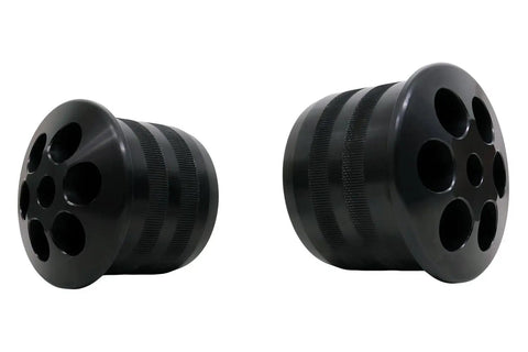 Beefy Aluminum Rear Cradle Bushing Kit For Hardcore Street Drift And Circuit Track Builds To Zero Out Body Roll Boost Chassis Stiffness And Stick Every Turn With Direct Bolt On Install For Easy Garage Swaps, showing two black bushing mounts.