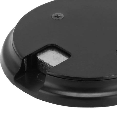 Close-up of the base of Sleek Matte Black Zinc Alloy Push Type Door Stop Catch With Hold Open Floor Base, showing design details.
