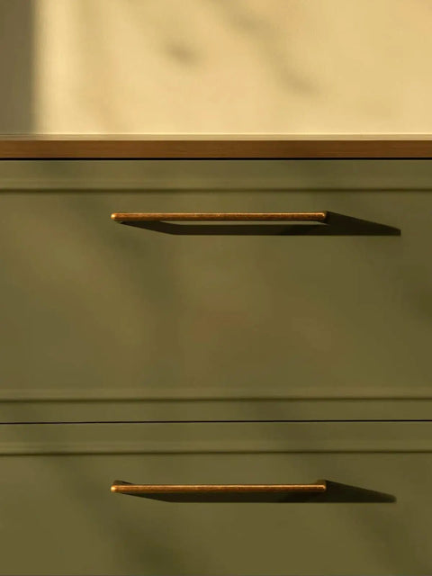 Close-up of Five Pack Antique Brass Cabinet Pulls, 7.56 Inch Hole Center Vintage Zinc Alloy Handles on green kitchen drawer.