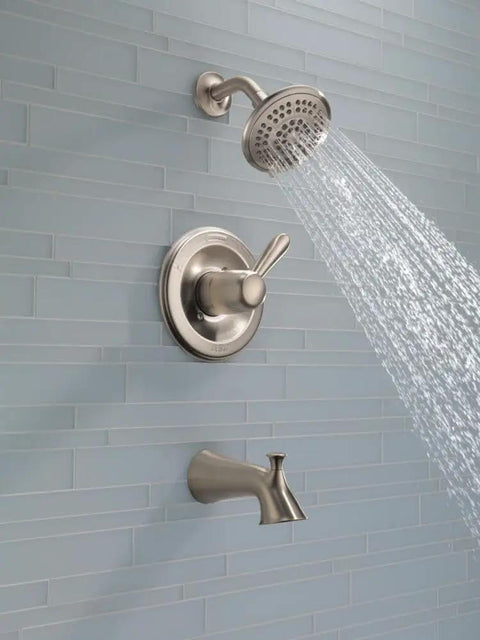 Slick Stainless Tub And Shower Trim Kit With Single Handle Faucet, 5 Spray Touch Clean Shower Head, Model T14438-SS shown in use