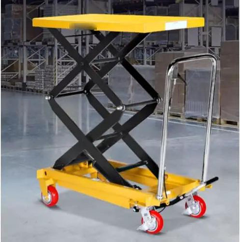 Premium Grade Badass Heavy Duty Manual Hydraulic Scissor Lift Table Cart with yellow top and black frame in garage setting.